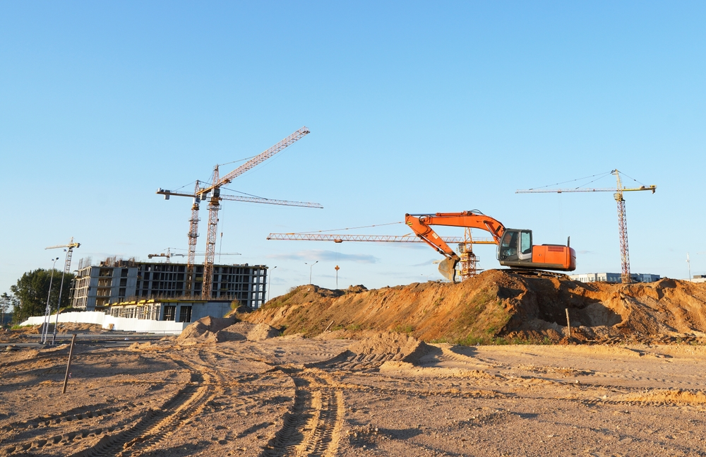 Site engineers reviewing plans on site